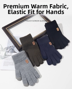 Detail of multi-color thick knitted touchscreen winter gloves for men with leather deer tag