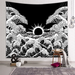 Detail of a large black and white sunset ocean wave tapestry on a white brick wall