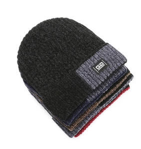 Close-up of assorted knit winter hats in five colors with soft chenille texture