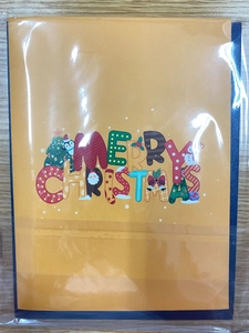 Macro shot of colorful 3D Merry Christmas card with Santa and snowman in plastic wrap