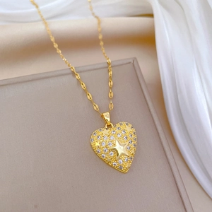 Golden heart necklace with star engraving and cubic zirconia on elegant beige gift box