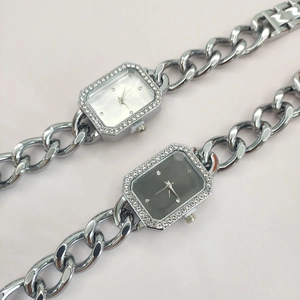 Detail of silver chain watches with crystal bezels in white and dark grey dial options