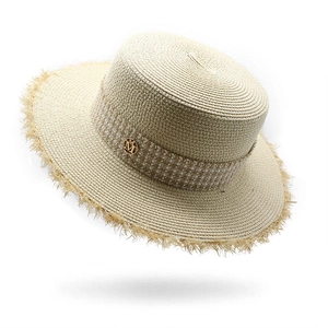 Chic beige raffia boater hat with a plaid ribbon, metal M charm and frayed edge
