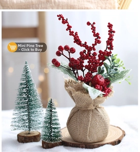 Mini cedar trees with snow on wood bases and a rustic berry burlap vase decor