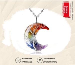 Detailed wire-wrapped silver tree of life pendant with colorful chakra stones in crescent moon
