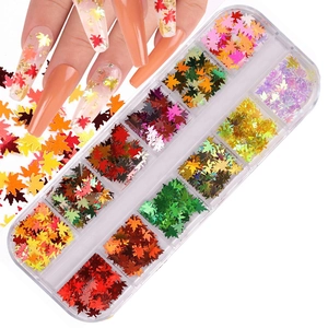 Detailed view of 12-grid maple leaf nail sequins set with vibrant colors and organizer