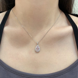 Detailed view of luxury S925 silver necklace with pear-cut pink zircon and diamond halo