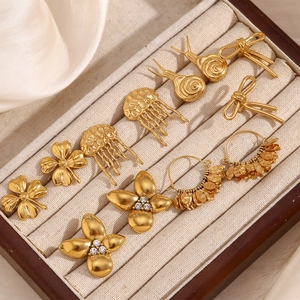 Selection of vintage 18K gold plated stainless steel floral and snail stud earrings