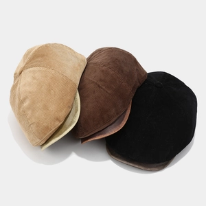 Vintage corduroy beret hats in khaki, brown and black colors with metallic brims