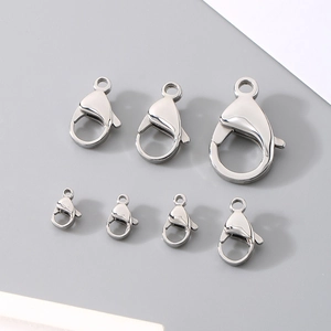Various sizes of stainless steel lobster clasps for jewelry making arranged by size