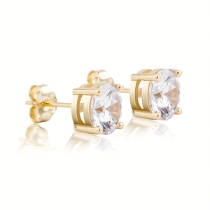 Detail of round cubic zirconia earrings with classic gold four-prong setting and secure backs