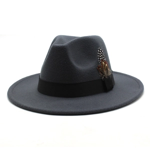 Detail of grey wool fedora hat featuring a black grosgrain ribbon and colorful feathers
