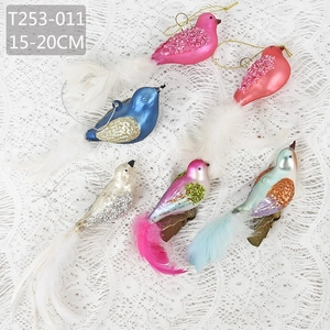 Set of glittery bird ornaments with feathers and clips for Christmas tree decoration