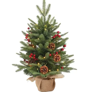 Mini tabletop Christmas tree with red berries, pine cones and warm LED lights