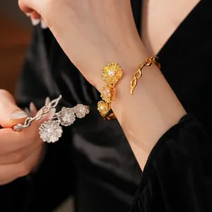 Vintage pearl and zircon flower cuff bracelet in brushed gold and silver metal