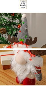 Detail of Christmas gnome with reindeer antlers, felt hat with buttons, and white beard