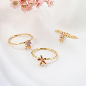 18K gold plated ocean rings set with colorful zircon gemstones on soft white fabric