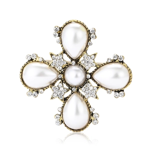 Vintage baroque cross brooch with golden alloy, white pearls and sparkling crystals