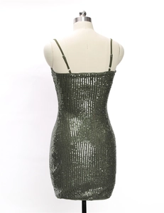 Detail view of the back of a green sequin mini dress with thin adjustable shoulder straps