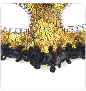 Detail of sequins lace trim and silver rhinestones on the Venetian masquerade mask