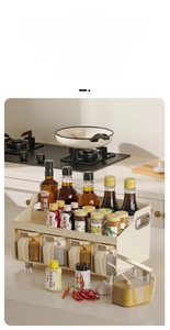 Detail of 2-tier cream kitchen rack showing top spice bottle storage and lower drawers
