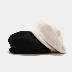 Japanese style knitted beret set in black and off-white with minimalist rolled edges