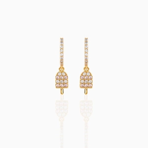 Macro shot of 18K gold plated ice cream earrings featuring pink and white zircon stones
