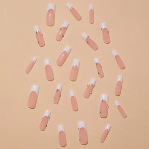 French extra long coffin press-on nails in nude and white with sparkling rhinestones