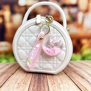 Creative moon rabbit liquid quicksand keychain with pink silicone strap and golden bell