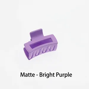 Detail view of the mini 4cm matte bright purple hollow square hair claw clip for women