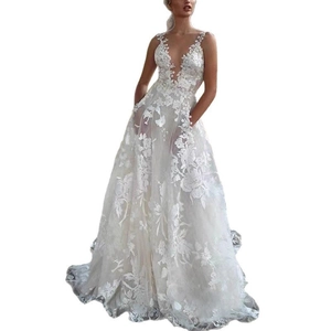 White lace wedding gown with deep V-neck and floral embroidery in an A-line silhouette