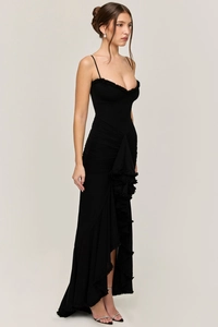 Detail of elegant black maxi dress featuring refined waist ruching and tiered ruffles