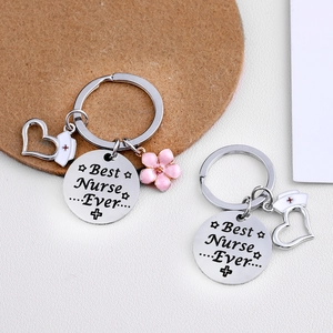 Polished silver stainless steel Best Nurse Ever keychains with heart and pink floral charms