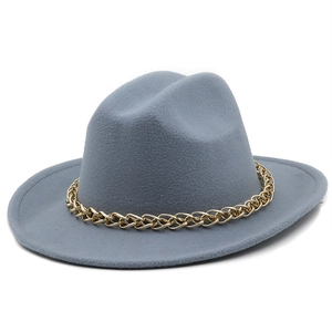 Detail of grey-blue felt fedora featuring a decorative chunky gold chain link band