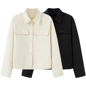 Flat lay detail of women's vintage lapel jackets in cream and black with utility pockets