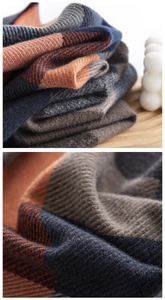 Macro view of blue and orange checkered cashmere-like fabric texture and weave detail
