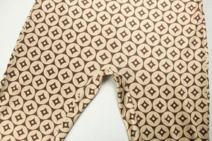 Detail of reinforced crotch seams and geometric print on stretch knit bodysuit