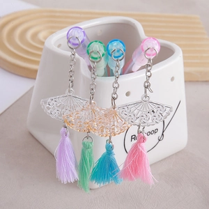Set of 4 creative pastel neutral pens with fan-shaped pendants and decorative tassels