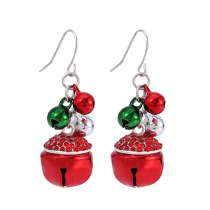 Detail view of festive Christmas earrings with red bells and green rhinestone accents