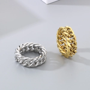 Polished Cuban chain link rings in gold and silver finish shown on neutral background