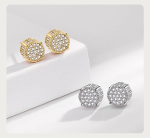 Macro detail of gold and silver hip hop stud earrings with micro paved cubic zirconia