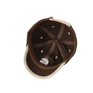 Minimalist kids' baseball cap in brown and cream canvas with 6-panel interior detail