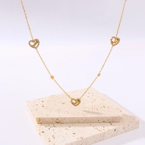 18K gold plated stainless steel necklace featuring three heart love pendants on stone