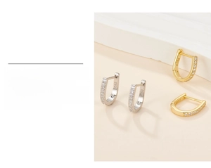 Close-up of S925 sterling silver horseshoe hoop earrings with gold plating and zircons