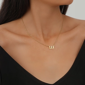 Gothic lucky number 111-999 pendant necklace in gold finish worn by a fashion model