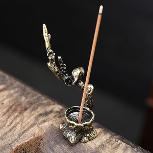 Porte-encens en bronze vintage avec oiseau sur branche de prunier et base en tronc d'arbre