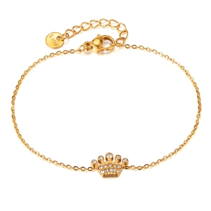 Gold stainless steel bracelet featuring a crystal crown pendant and lobster clasp closure