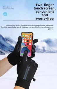 Close-up of touchscreen index finger and thumb on black winter sports gloves in snow