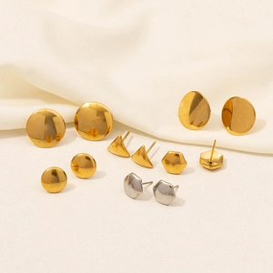 Close-up of geometric 304 stainless steel stud earrings in gold and silver mirror finish