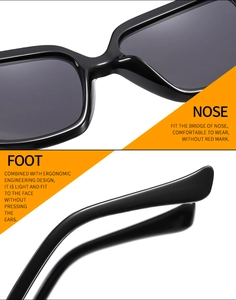Detail of ergonomic bridge and curved temples on black oversized cat eye sunglasses